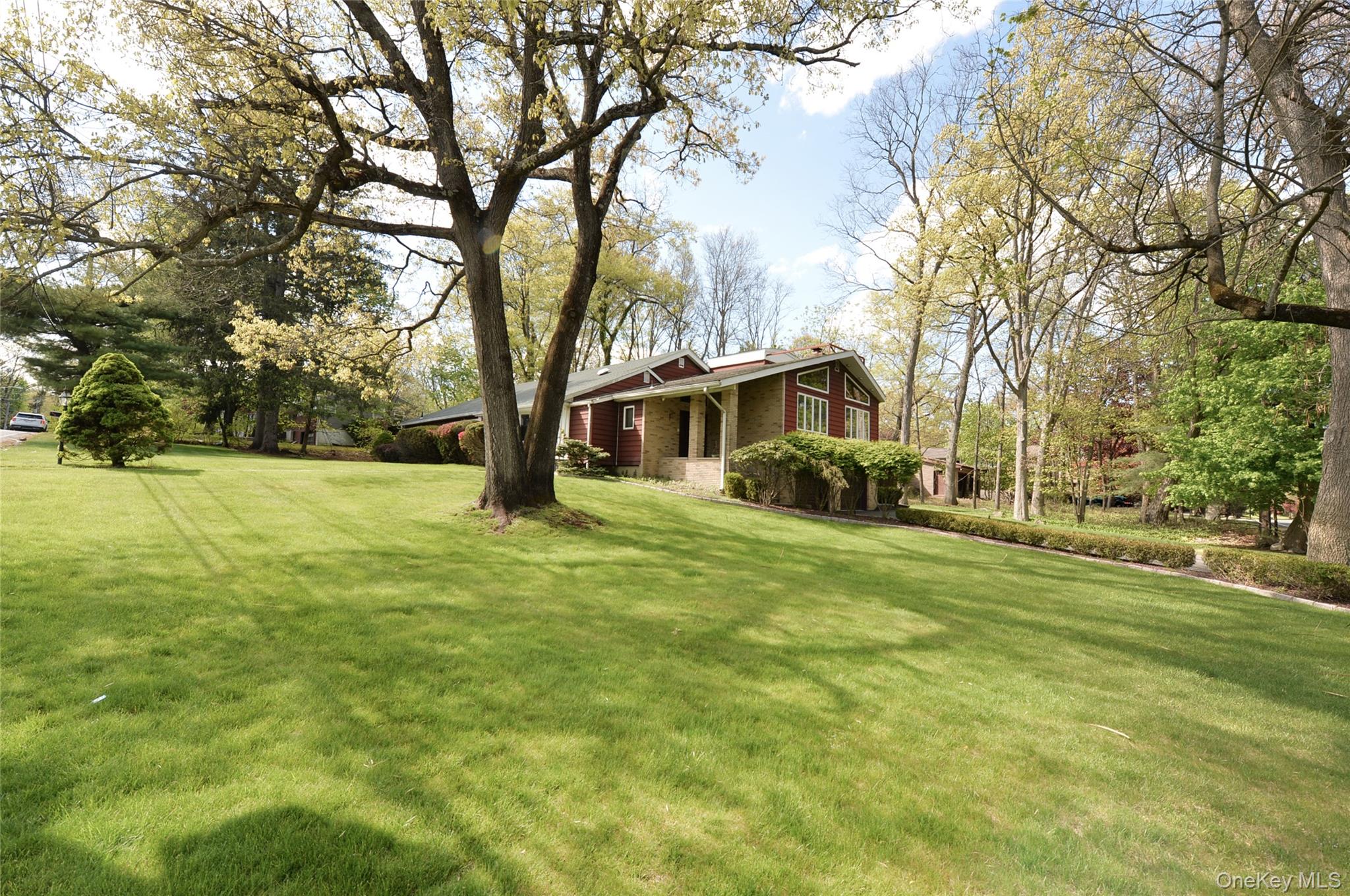 24 Highview Road Monsey, NY 10952 - Photo 43 of 44 a front view of a house with a big yard
