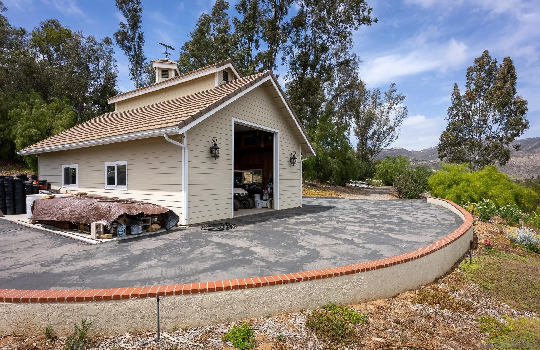 17509 Rancho Del Rio Rancho Santa Fe, CA 92067 - Photo 45 of 67 a view of a house with a yard covered in snow