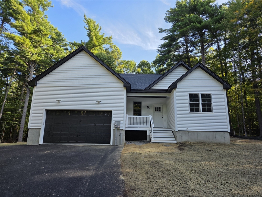 a front view of a house with garage