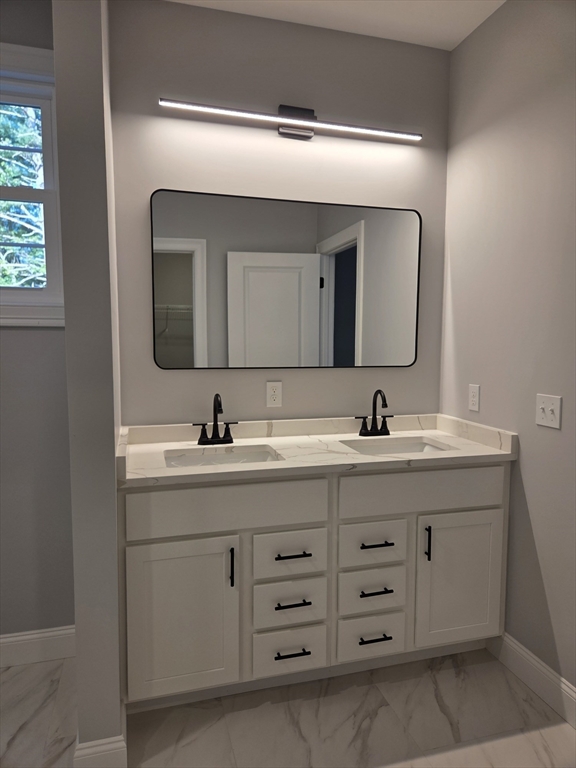 65 Adams Road Townsend, MA 01469 - Photo 11 of 18 a bathroom with a double vanity sink and mirror