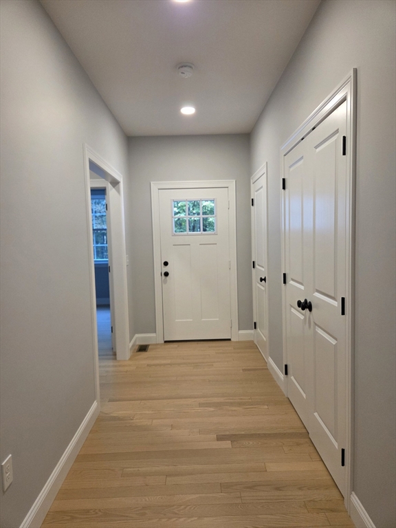 65 Adams Road Townsend, MA 01469 - Photo 8 of 18 a view of a hallway with wooden floor