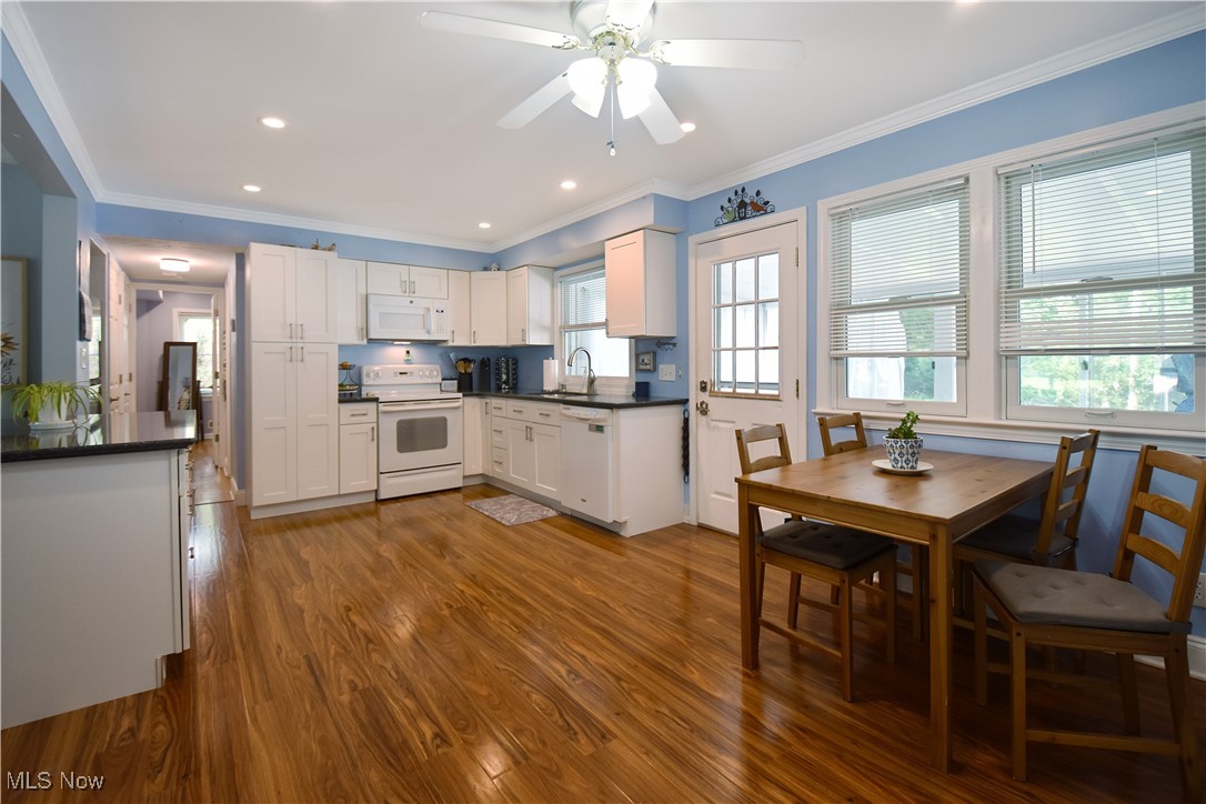 1388 Ford Road Lyndhurst, OH 44124 - Photo 8 of 39 Kitchen featuring white cabinetry, wood-type flooring, white appliances, and ceiling fan