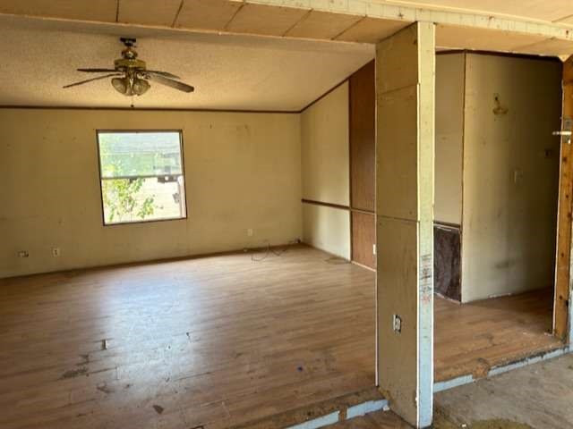 3702 Park Street Damon, TX 77430 - Photo 2 of 12 an empty room with windows and a ceiling fan