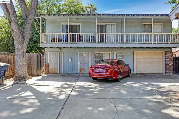 a view of a car park in front of house