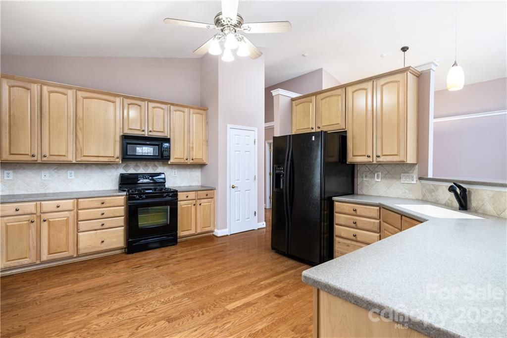 361 Garnet Court Fort Mill, SC 29708 - Photo 12 of 38 a kitchen with stainless steel appliances granite countertop a refrigerator stove microwave and sink