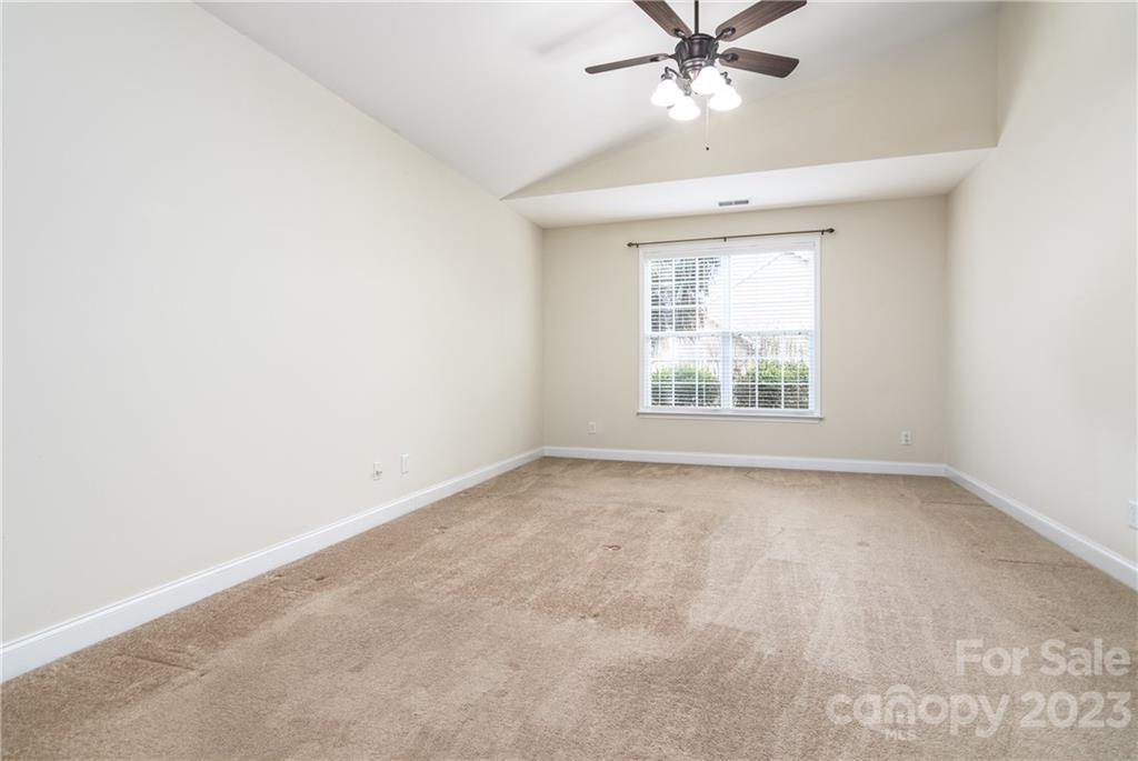 361 Garnet Court Fort Mill, SC 29708 - Photo 13 of 38 an empty room with a window and a fan