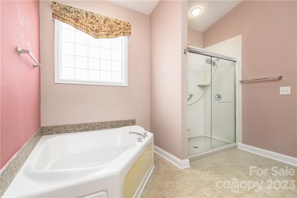 361 Garnet Court Fort Mill, SC 29708 - Photo 17 of 38 a bathroom with a tub and a shower