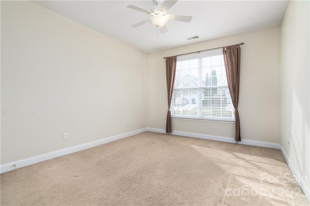 361 Garnet Court Fort Mill, SC 29708 - Photo 18 of 38 an empty room with windows and fan