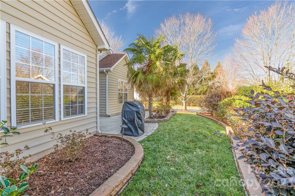 361 Garnet Court Fort Mill, SC 29708 - Photo 23 of 38 a front view of a house with garden