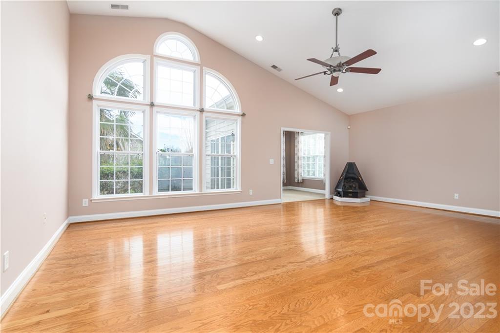 361 Garnet Court Fort Mill, SC 29708 - Photo 6 of 38 a view of an empty room with window and chandelier fan