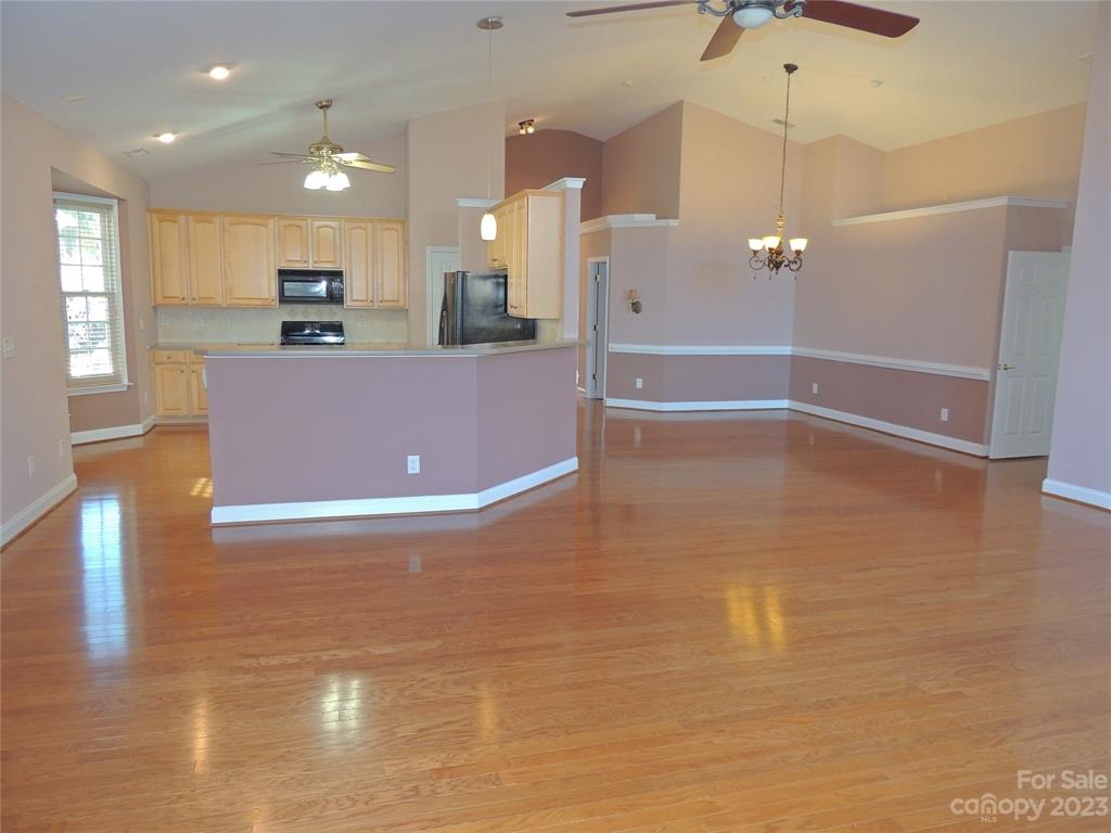 361 Garnet Court Fort Mill, SC 29708 - Photo 9 of 38 a view of kitchen with stainless steel appliances granite countertop cabinets and wooden floor