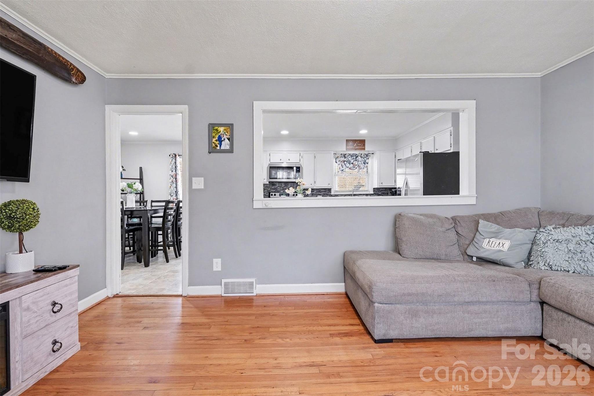 216 Malcolm Road Salisbury, NC 28144 - Photo 12 of 38 a living room with furniture and wooden floor