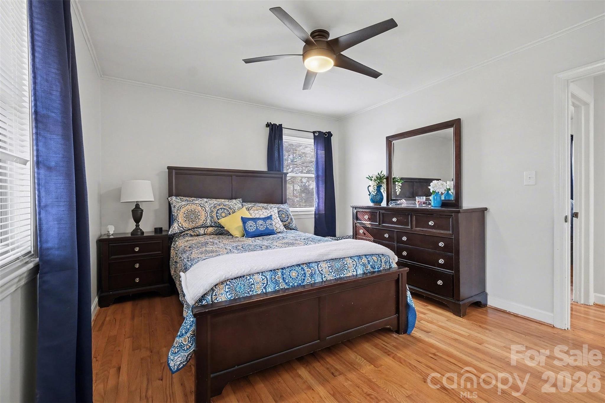 216 Malcolm Road Salisbury, NC 28144 - Photo 16 of 38 a bedroom with a bed and a chandelier