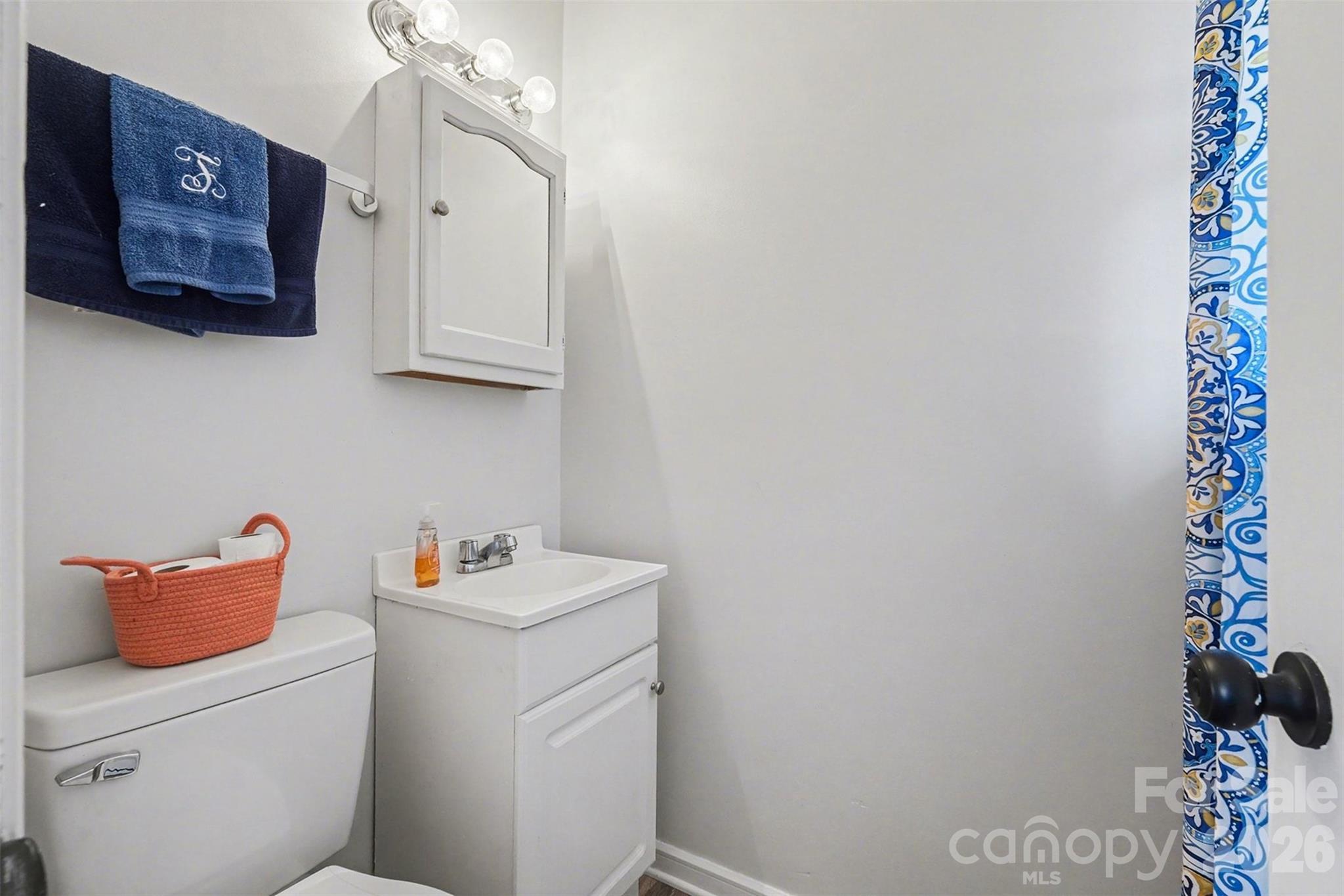 216 Malcolm Road Salisbury, NC 28144 - Photo 19 of 38 a bathroom with a toilet and a sink