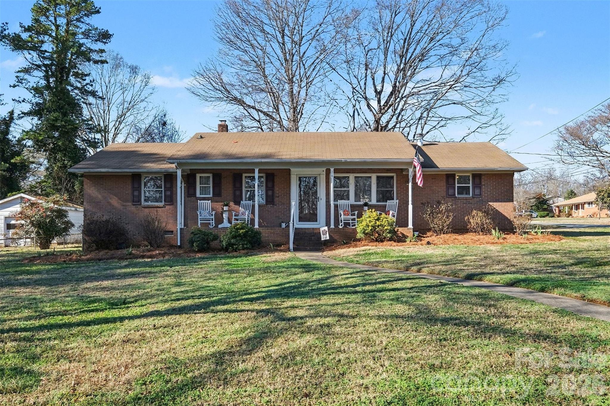 216 Malcolm Road Salisbury, NC 28144 - Photo 32 of 38 a view of a house with a yard patio and palm tree