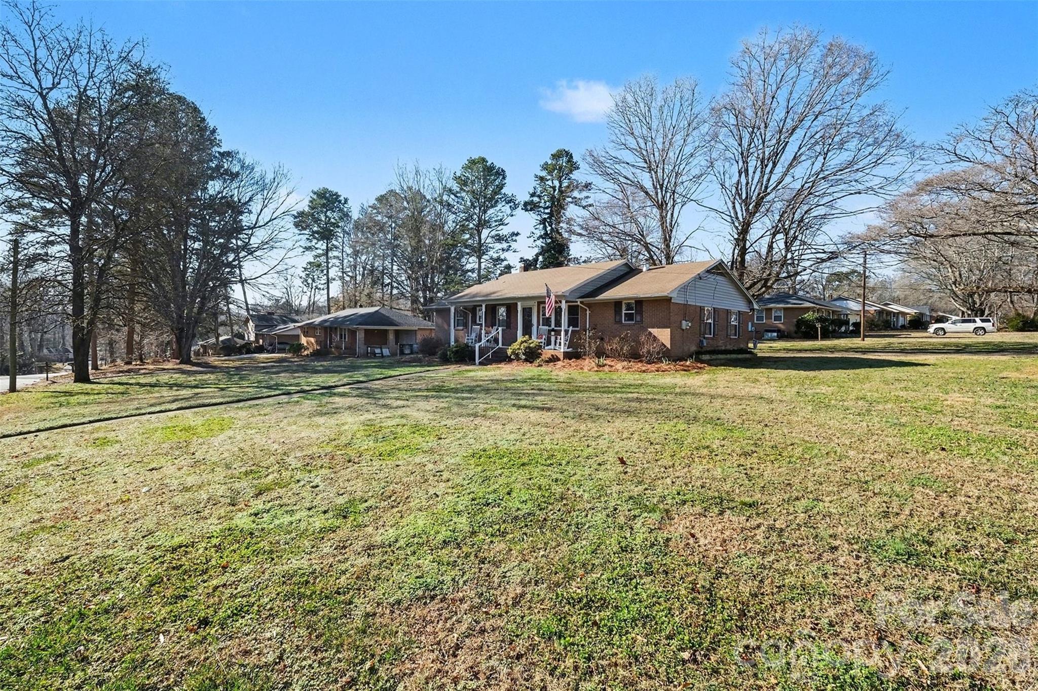 216 Malcolm Road Salisbury, NC 28144 - Photo 34 of 38 a view of a house with a big yard and large trees