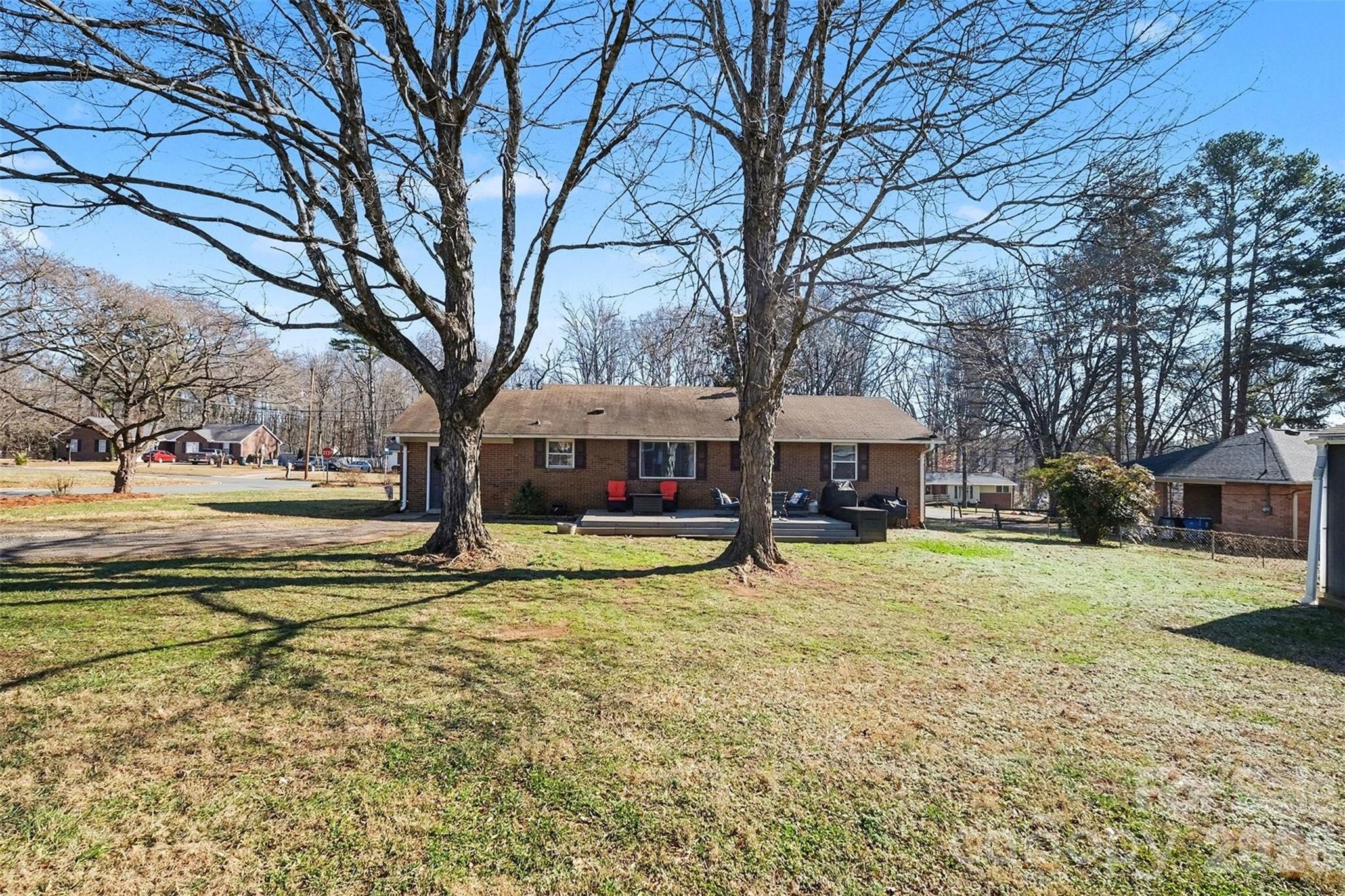 216 Malcolm Road Salisbury, NC 28144 - Photo 35 of 38 a view of a house with a yard covered with trees