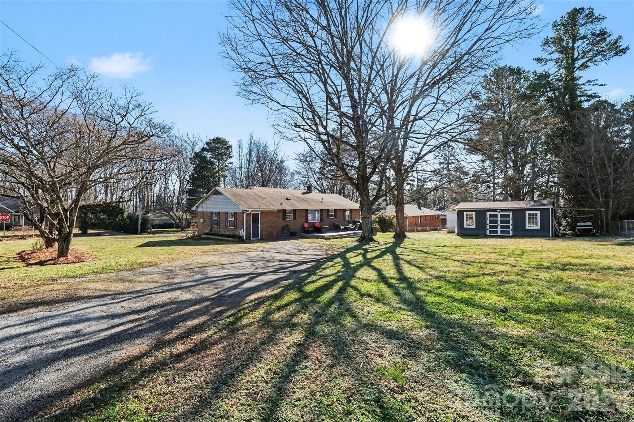 216 Malcolm Road Salisbury, NC 28144 - Photo 38 of 38 a view of a house with a yard and large trees