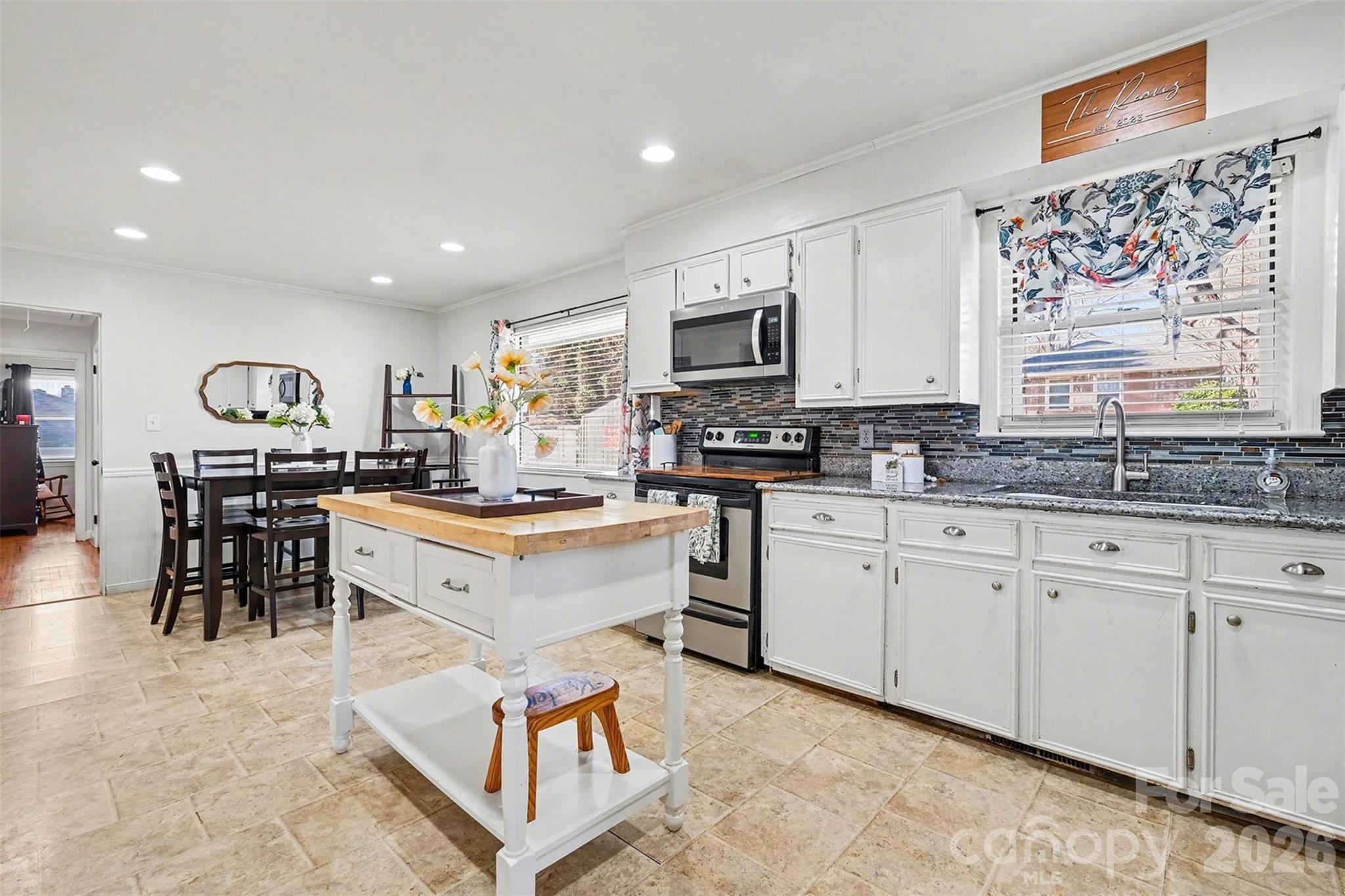 216 Malcolm Road Salisbury, NC 28144 - Photo 7 of 38 a kitchen with stainless steel appliances kitchen island granite countertop a sink and cabinets