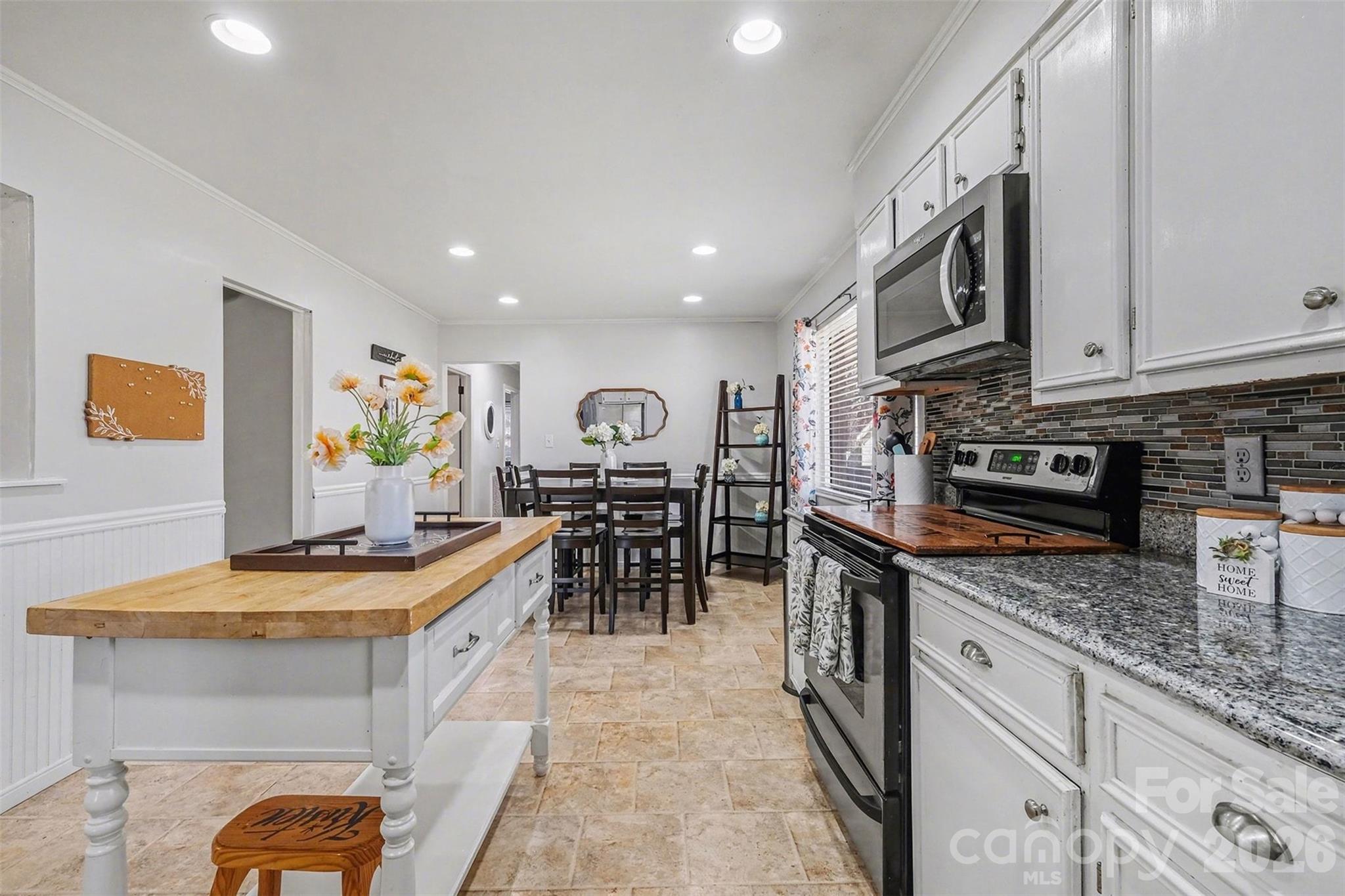216 Malcolm Road Salisbury, NC 28144 - Photo 8 of 38 a kitchen with stainless steel appliances granite countertop a stove and a sink