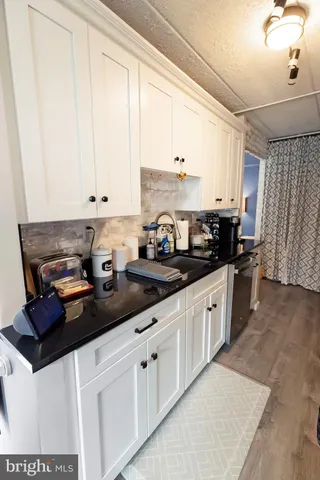 a kitchen with stainless steel appliances a stove a microwave and a refrigerator