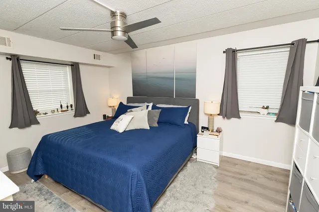 a bed sitting in a room next to a window