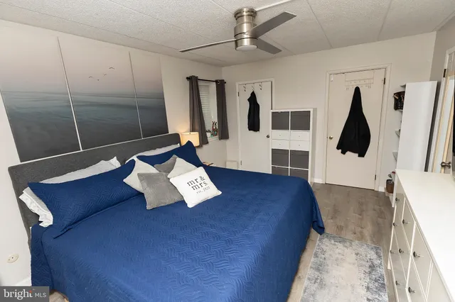 a white toilet sitting next to a bath tub