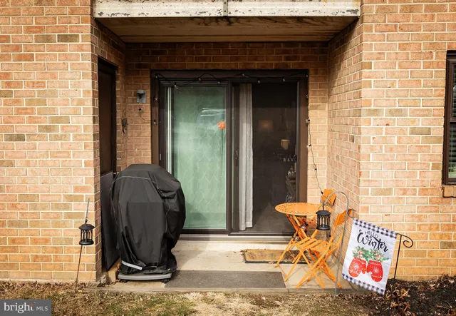a living room with furniture and a dining table