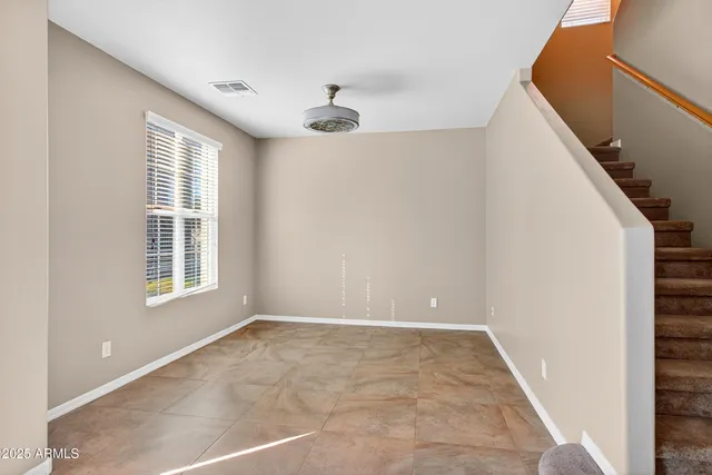 a view of an empty room with windows