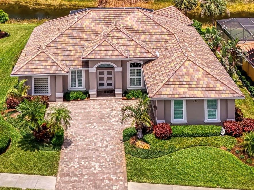 front view of a house with a yard