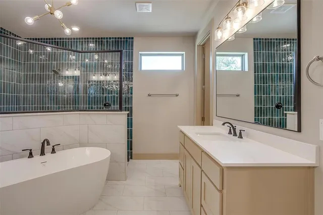 a bathroom with a bathtub and a sink