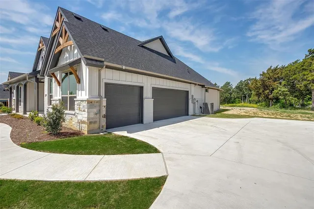 a view of white house with a yard