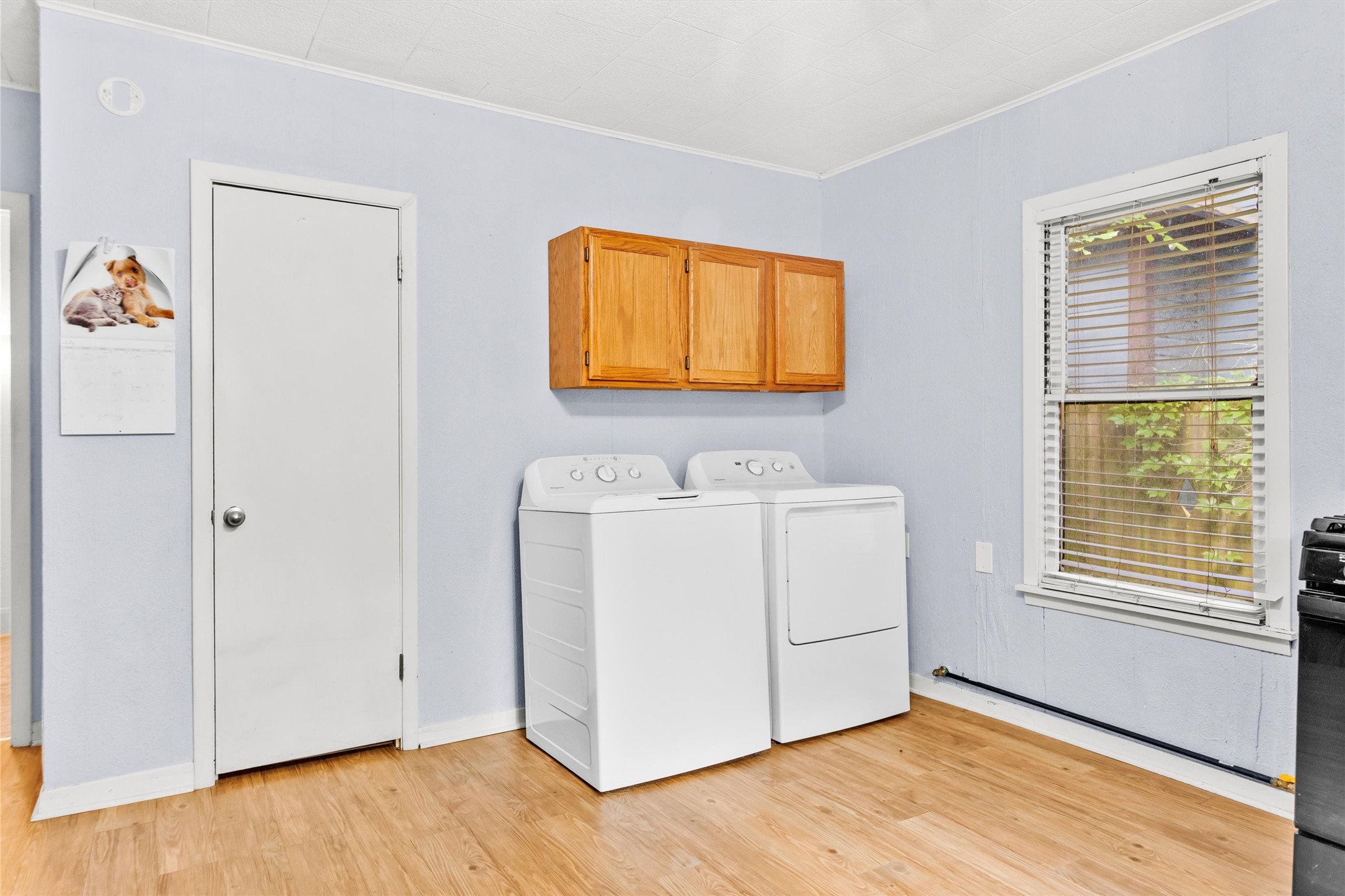 1720 18th Street Huntsville, TX 77340 - Photo 18 of 37 a utility room with a window dryer and washer