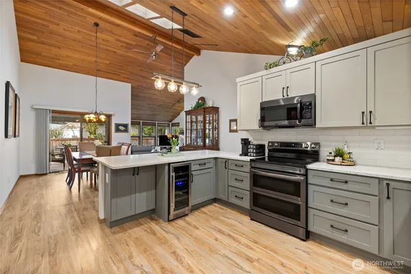 a kitchen with stainless steel appliances a stove sink and cabinets