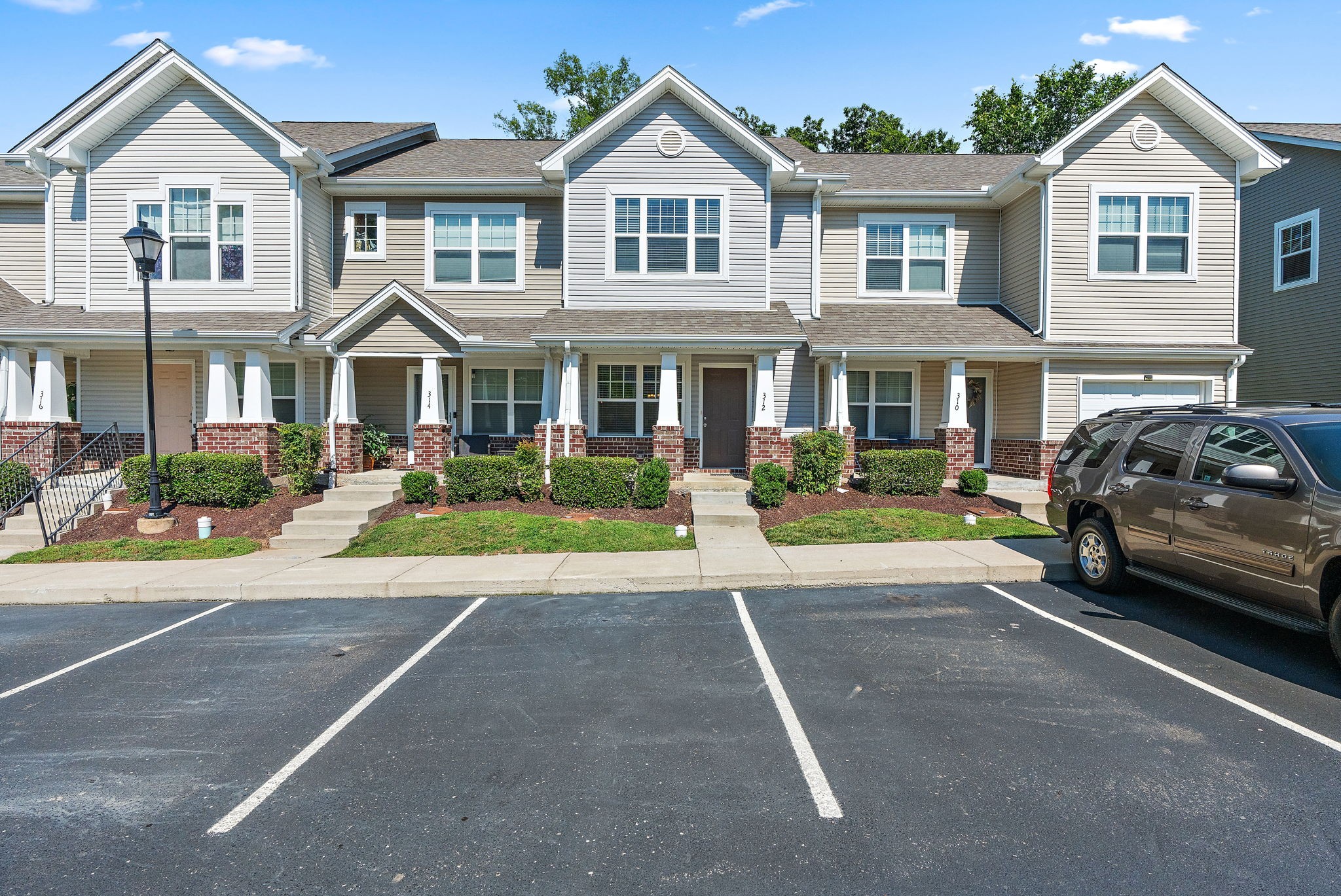a view of multiple houses with a street