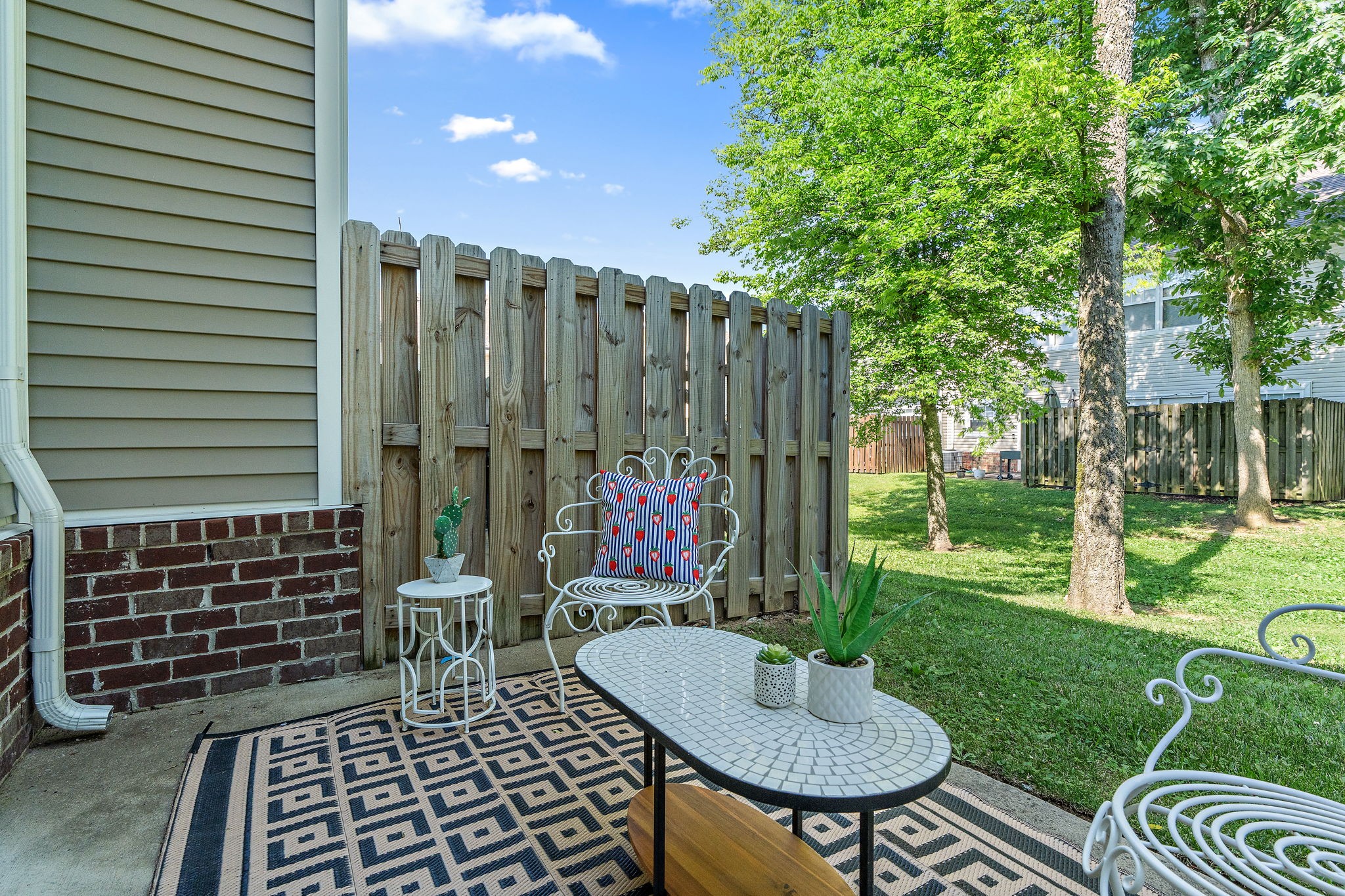 312 McKenzie Pass Madison, TN 37115 - Photo 19 of 21 a view of a chairs and table in backyard of the house