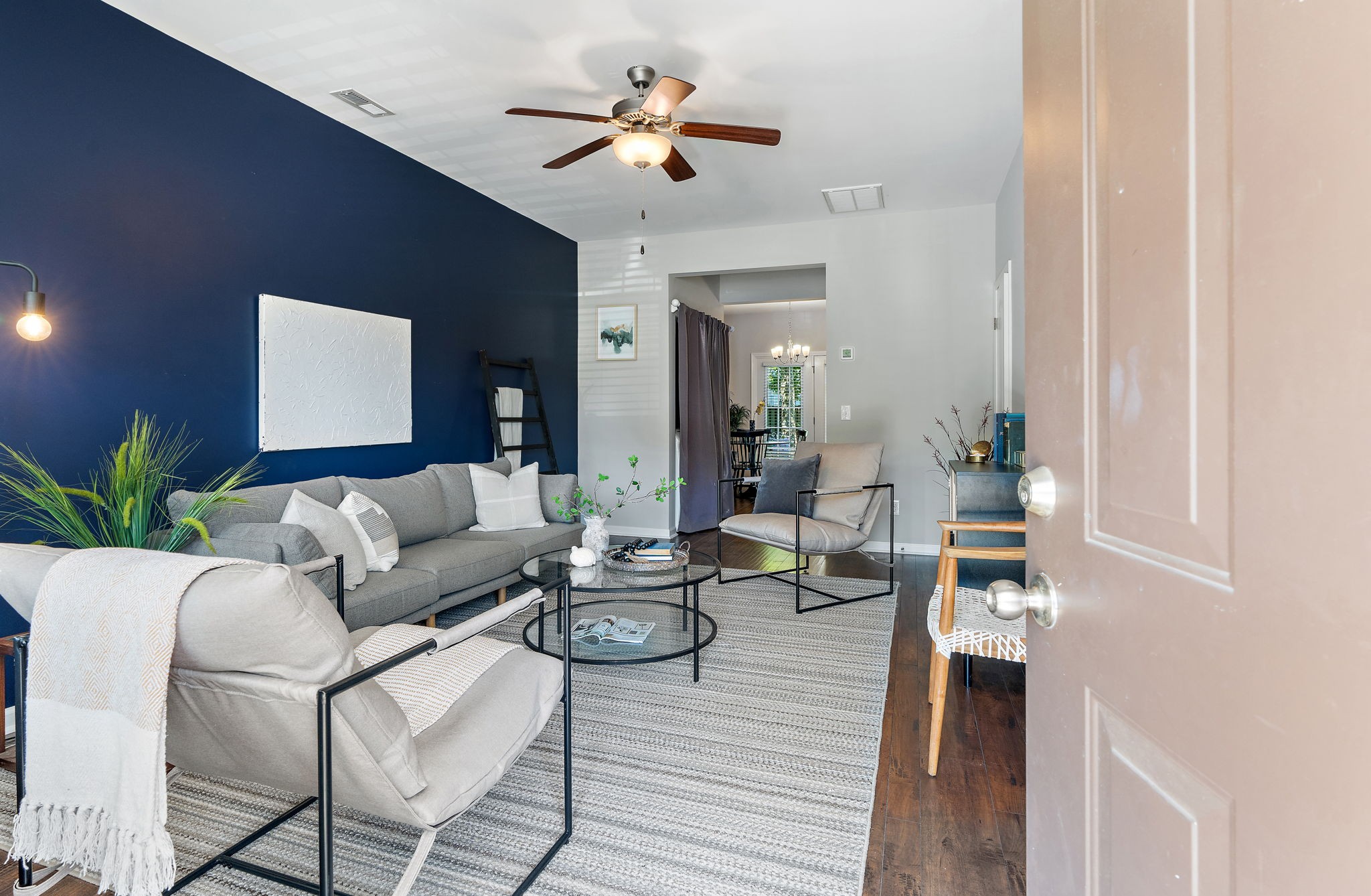 312 McKenzie Pass Madison, TN 37115 - Photo 3 of 21 a living room with furniture a chandelier and a potted plant