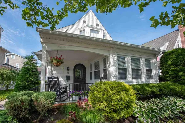 a view of front of house with potted flower