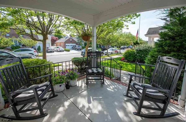 a view of a patio with two chairs and a table