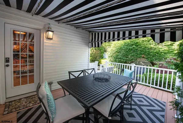 a view of a chairs and table on the deck