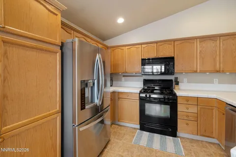 a kitchen with a refrigerator stove and microwave