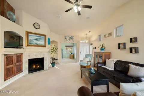 a living room with furniture and fireplace