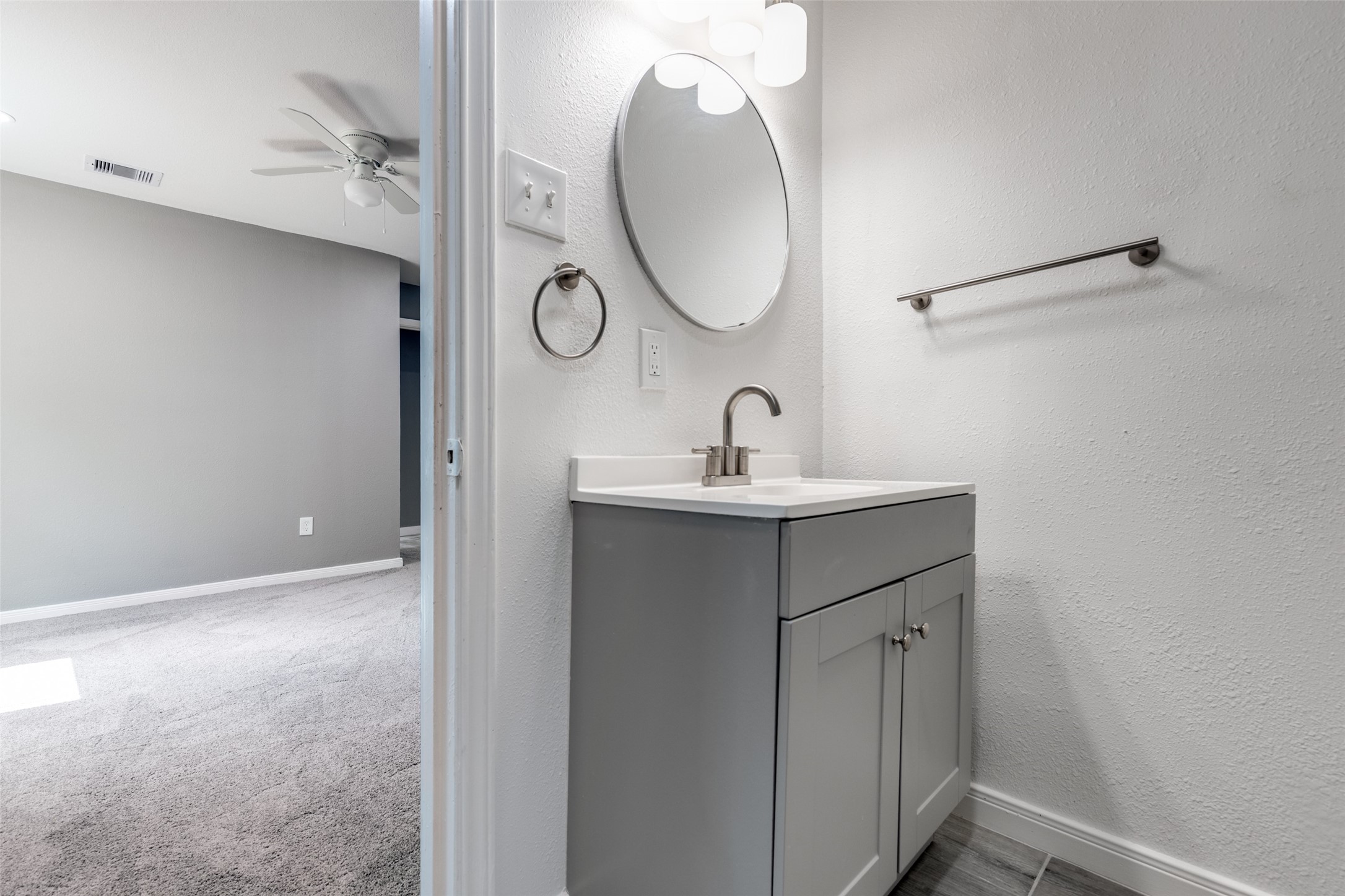 200 Pine Street Prairie View, TX 77446 - Photo 13 of 25 a bathroom with a sink and a mirror