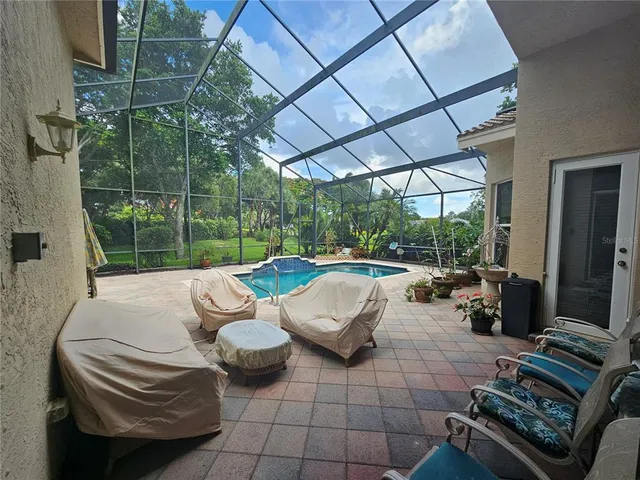 a view of a swimming pool with a patio