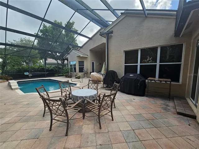 a kitchen with counter top space a sink and stainless steel appliances