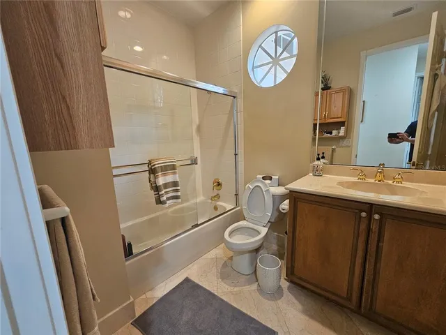 a view of a bathroom with a shower and a sink