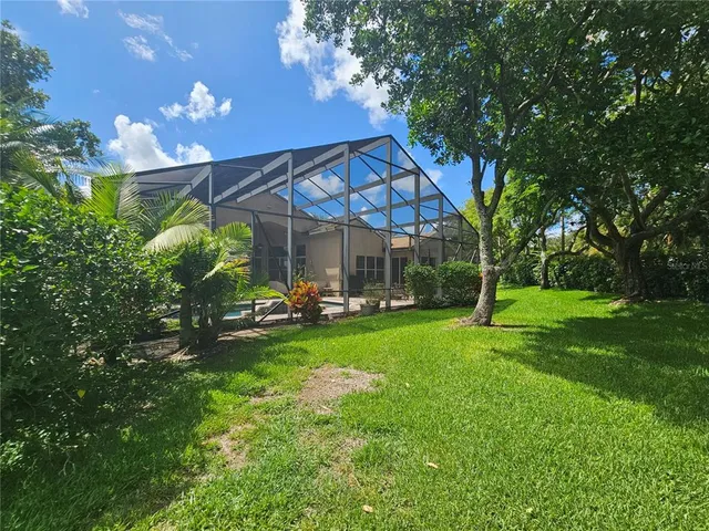 a view of a patio with swimming pool table and chairs