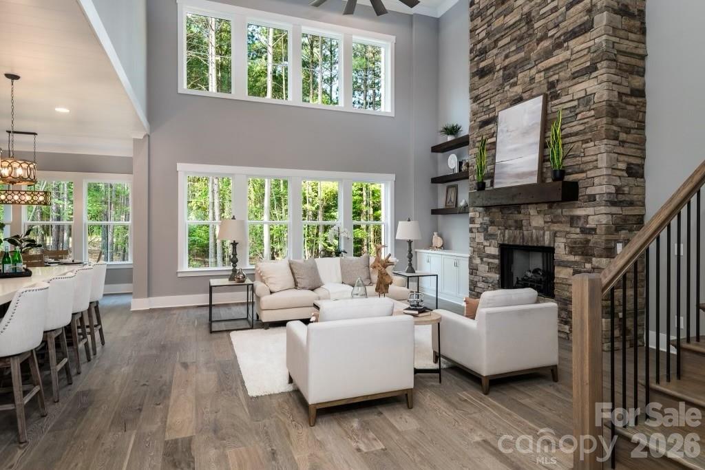 116 Silver Falls Road Troutman, NC 28166 - Photo 12 of 46 a living room with furniture and a fireplace