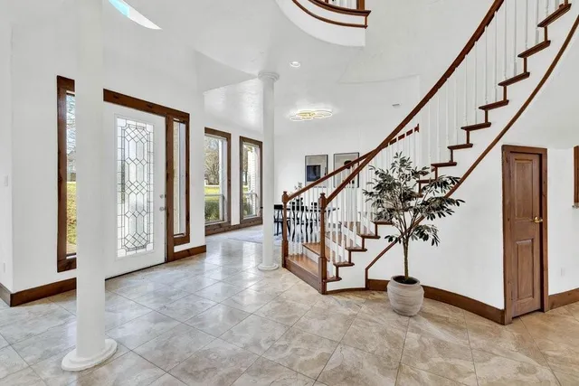 a bedroom with a large bed and a window