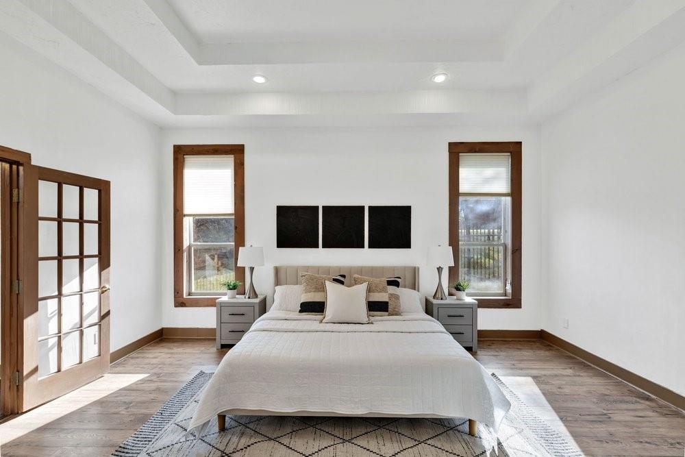 324 Rolling Oaks Ridge Cedar Hill, TX 75104 - Photo 13 of 39 a bedroom with a large bed and a window